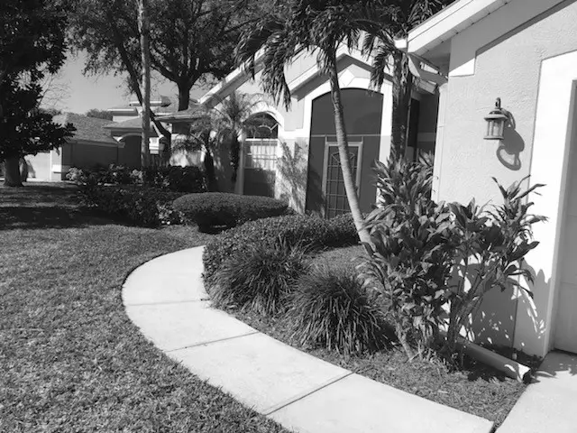 house landscaped by Manases lawn